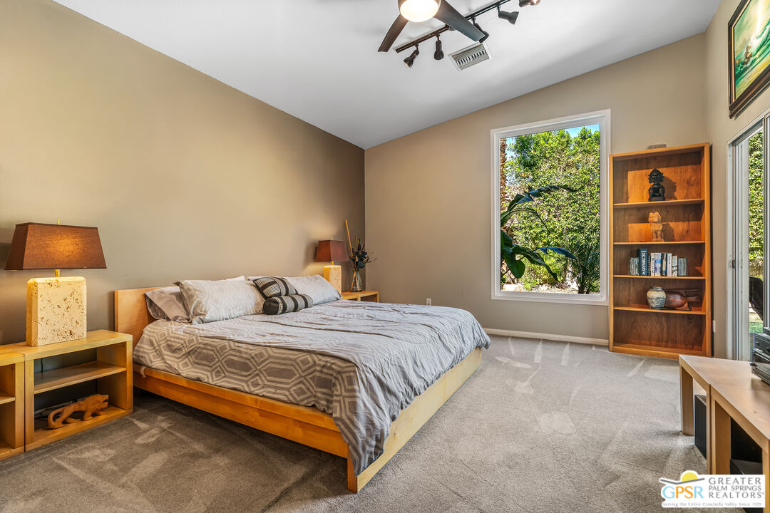 67860 Ontina Road Cathedral City, CA 92234 - Photo 19 of 48 a bedroom with a bed and a window