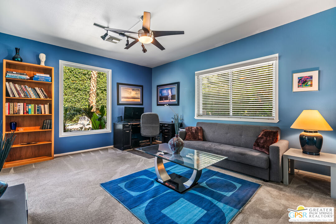 67860 Ontina Road Cathedral City, CA 92234 - Photo 25 of 48 a living room with furniture a window and a flat screen tv