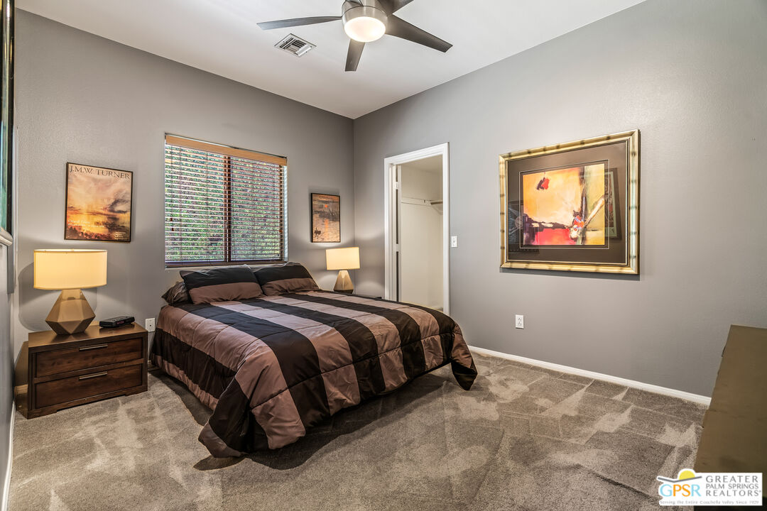 67860 Ontina Road Cathedral City, CA 92234 - Photo 28 of 48 a bedroom with a bed and a window