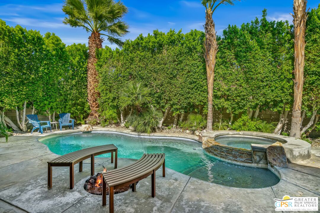 67860 Ontina Road Cathedral City, CA 92234 - Photo 37 of 48 a backyard of a house with table and chairs