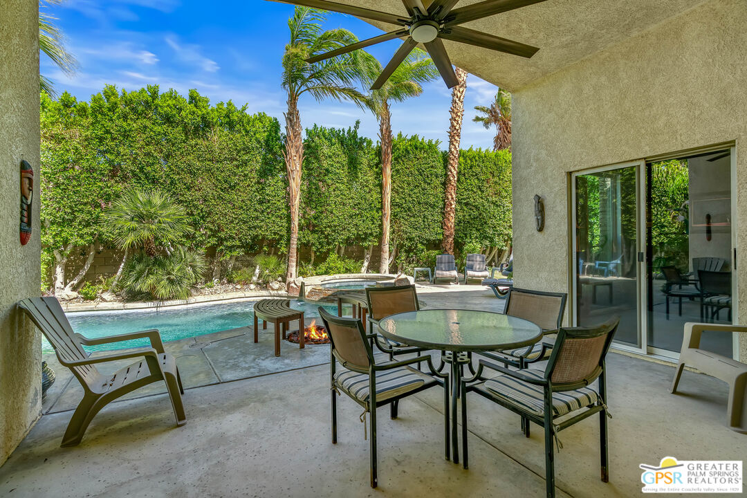 67860 Ontina Road Cathedral City, CA 92234 - Photo 39 of 48 a view of a patio with a table and chairs