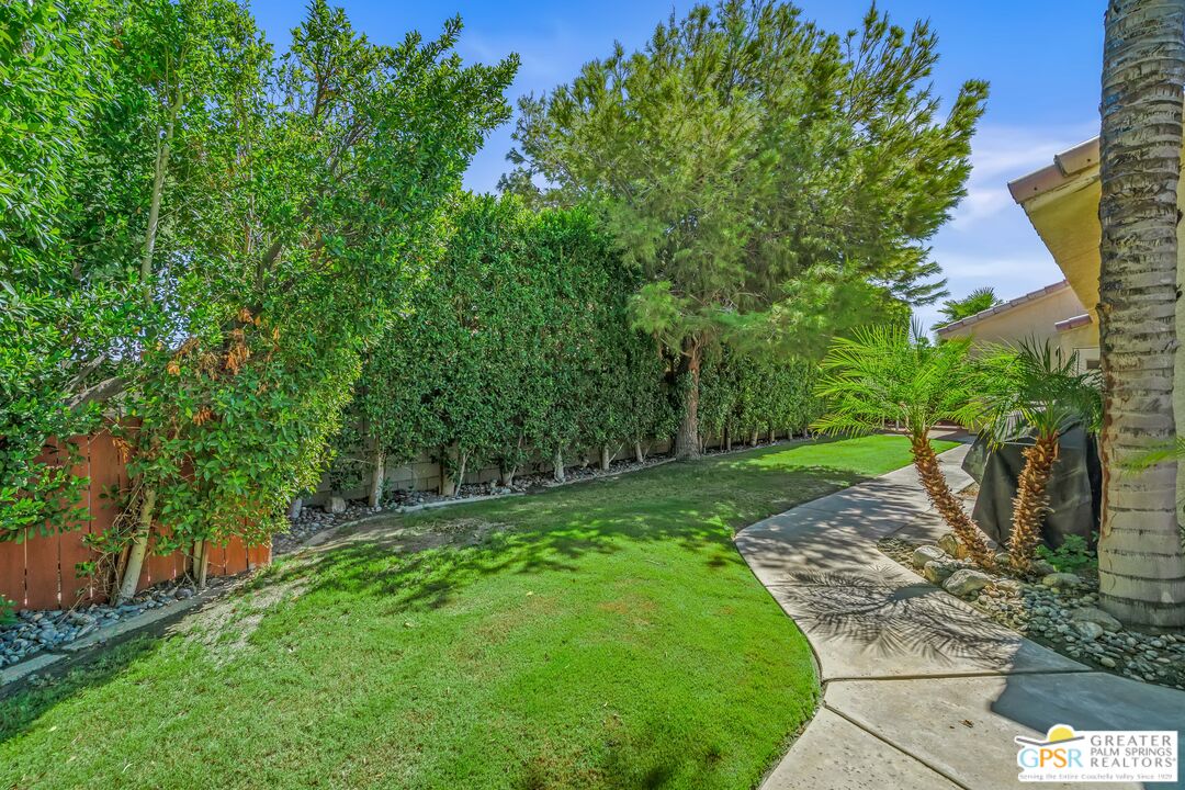 67860 Ontina Road Cathedral City, CA 92234 - Photo 40 of 48 a view of a yard with large trees