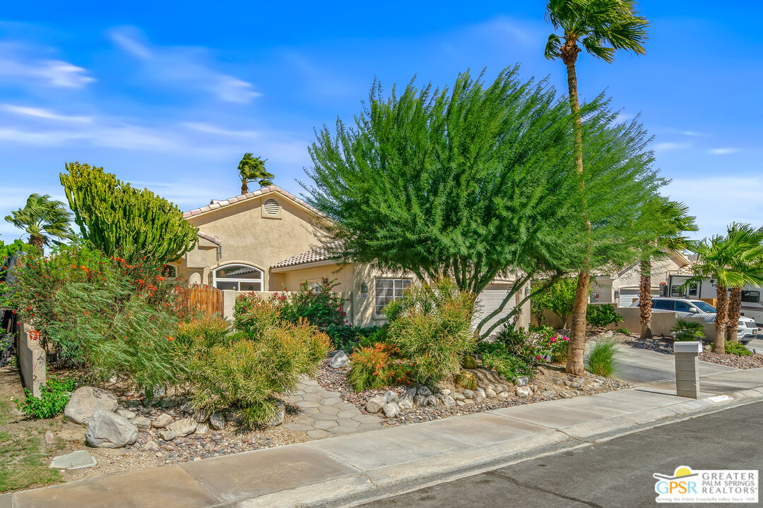 67860 Ontina Road Cathedral City, CA 92234 - Photo 42 of 48 a view of a house with a garden