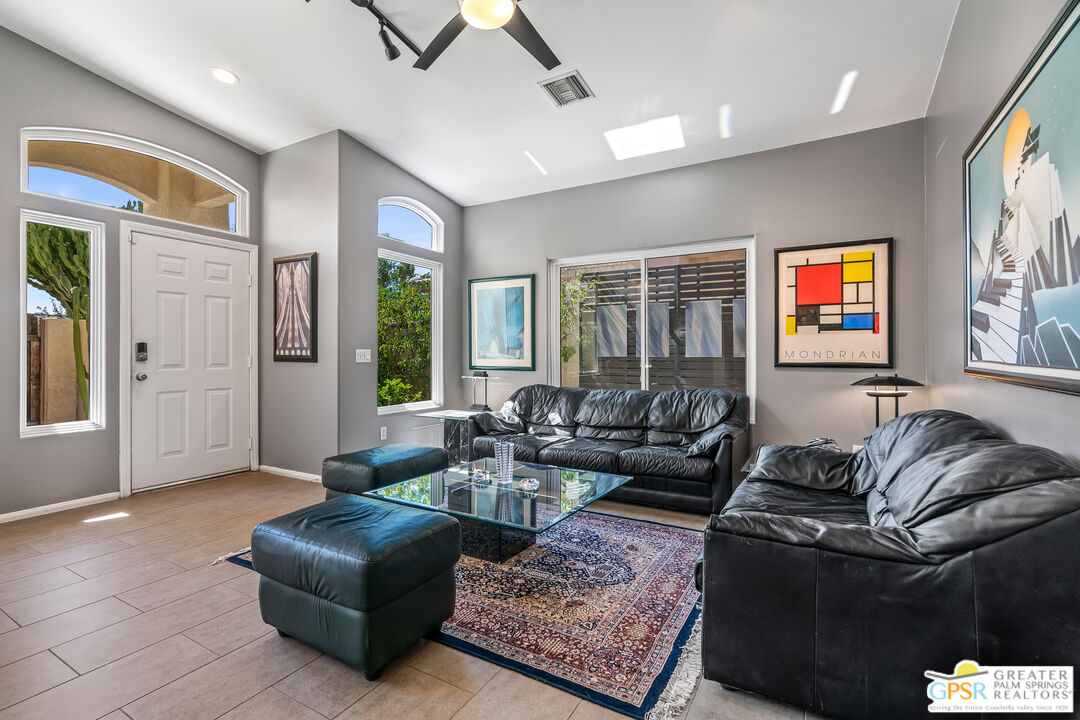 67860 Ontina Road Cathedral City, CA 92234 - Photo 5 of 48 a living room with furniture ceiling fan and a window