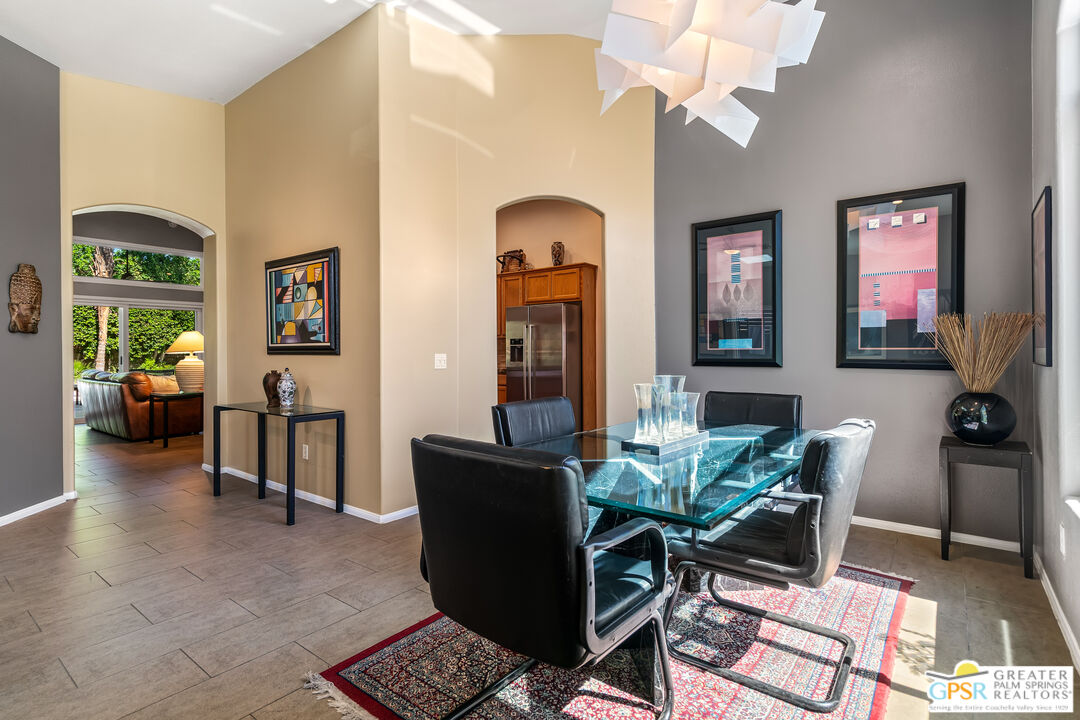 67860 Ontina Road Cathedral City, CA 92234 - Photo 9 of 48 a living room with furniture a chandelier and a window