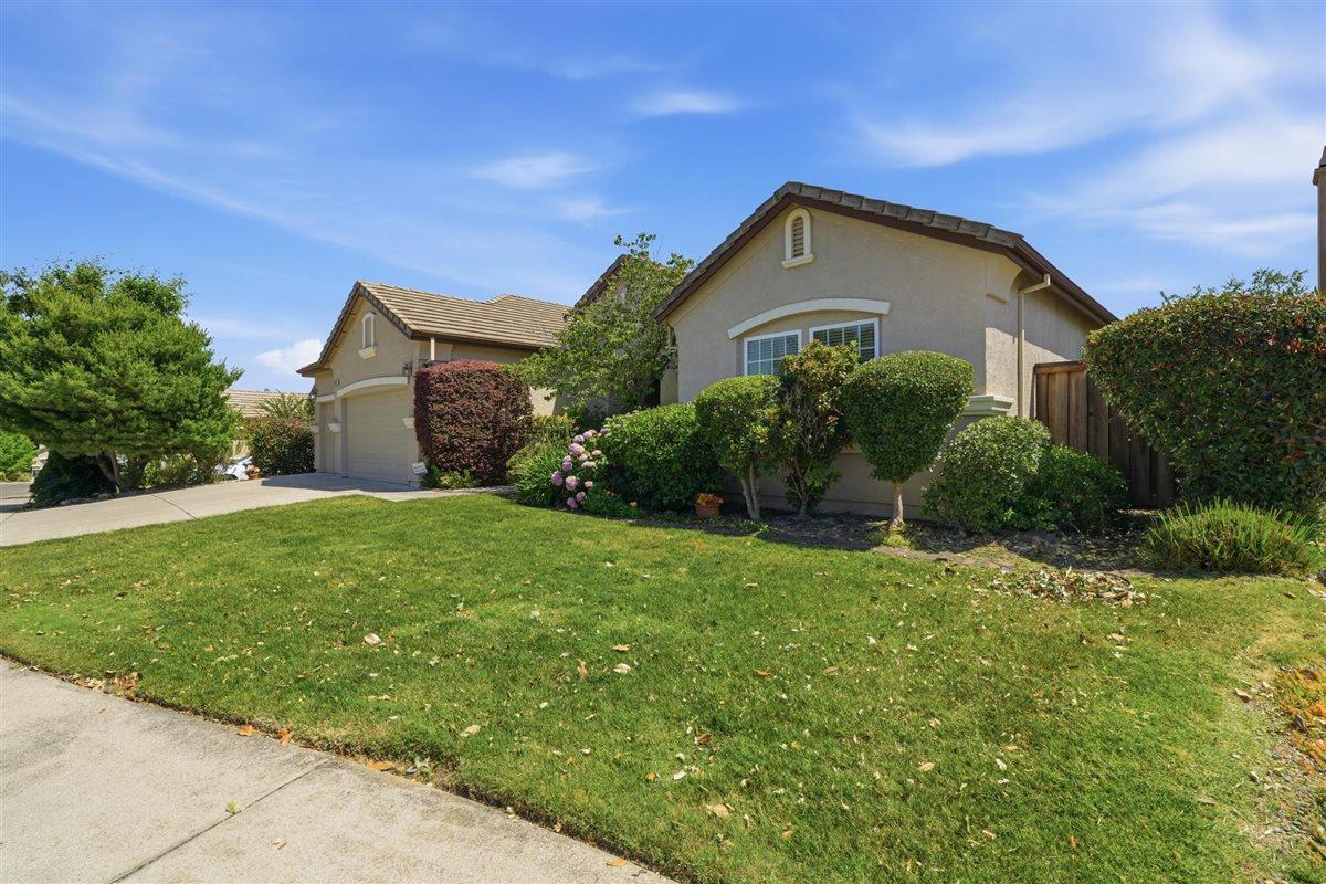 4129 Poppleton Way Carmichael, CA 95608 - Photo 2 of 48 a front view of a house with garden