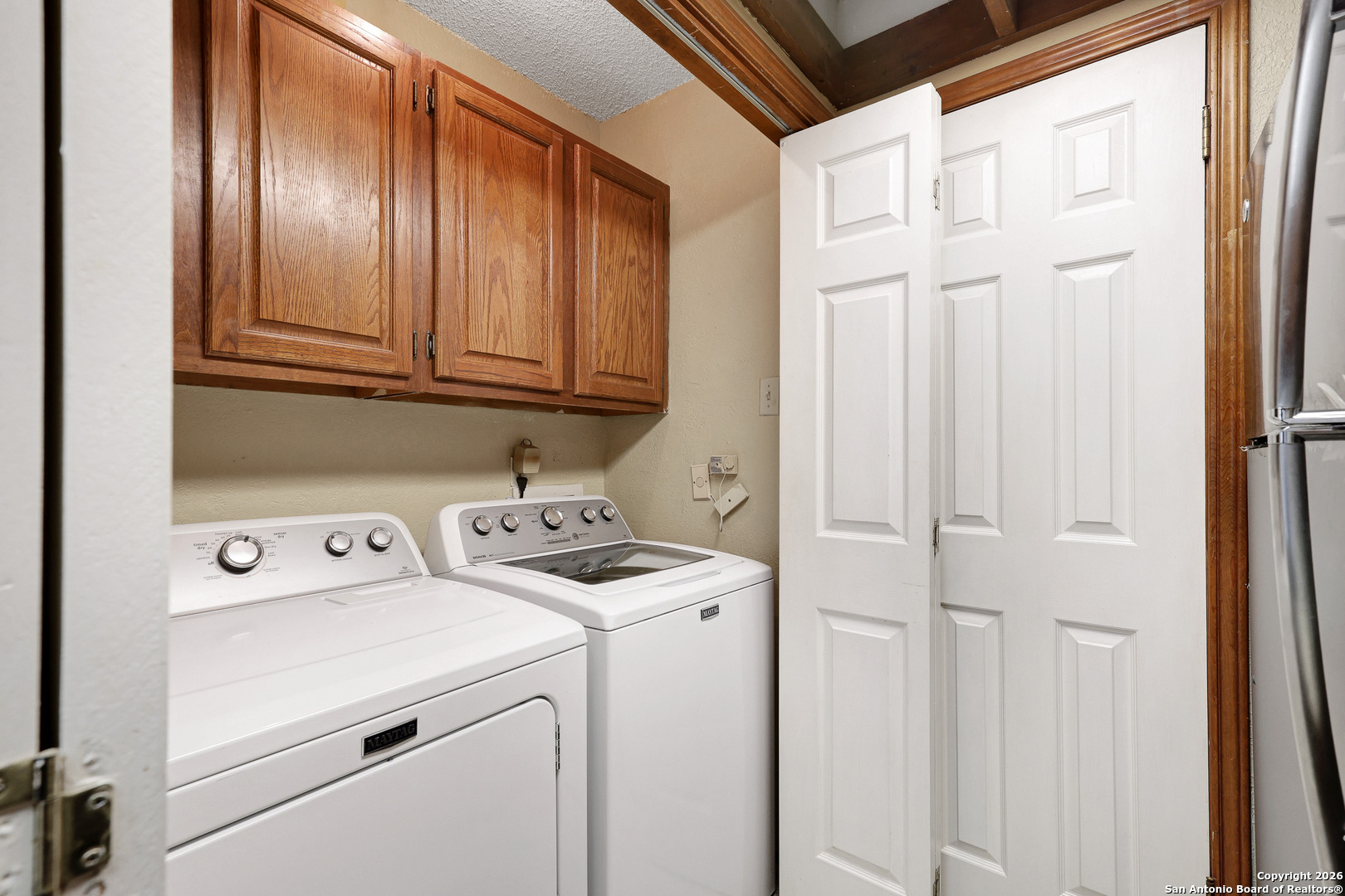 8633 Datapoint Drive, Unit 224 San Antonio, TX 78229 - Photo 14 of 27 a utility room with dryer and washer