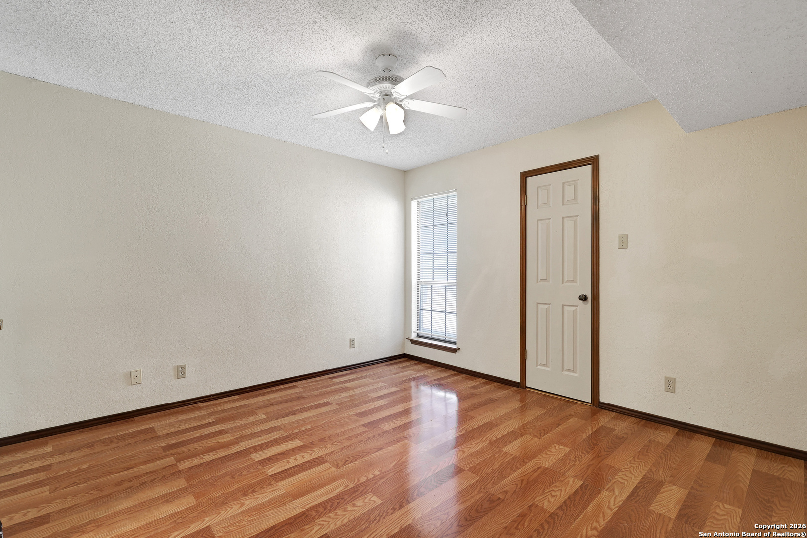 8633 Datapoint Drive, Unit 224 San Antonio, TX 78229 - Photo 15 of 27 a view of an empty room with wooden floor
