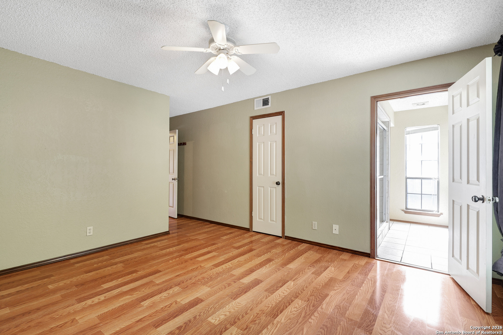 8633 Datapoint Drive, Unit 224 San Antonio, TX 78229 - Photo 19 of 27 a view of an empty room with wooden floor