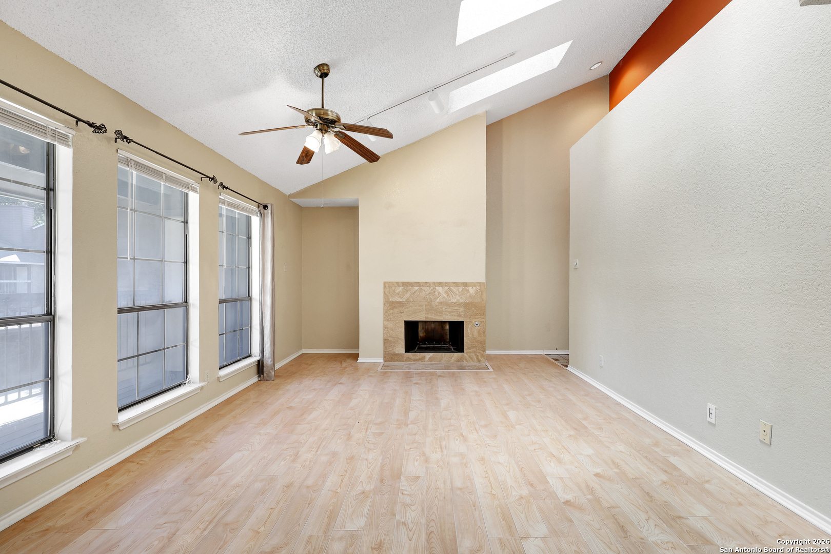 8633 Datapoint Drive, Unit 224 San Antonio, TX 78229 - Photo 3 of 27 a view of an empty room with window and fire place