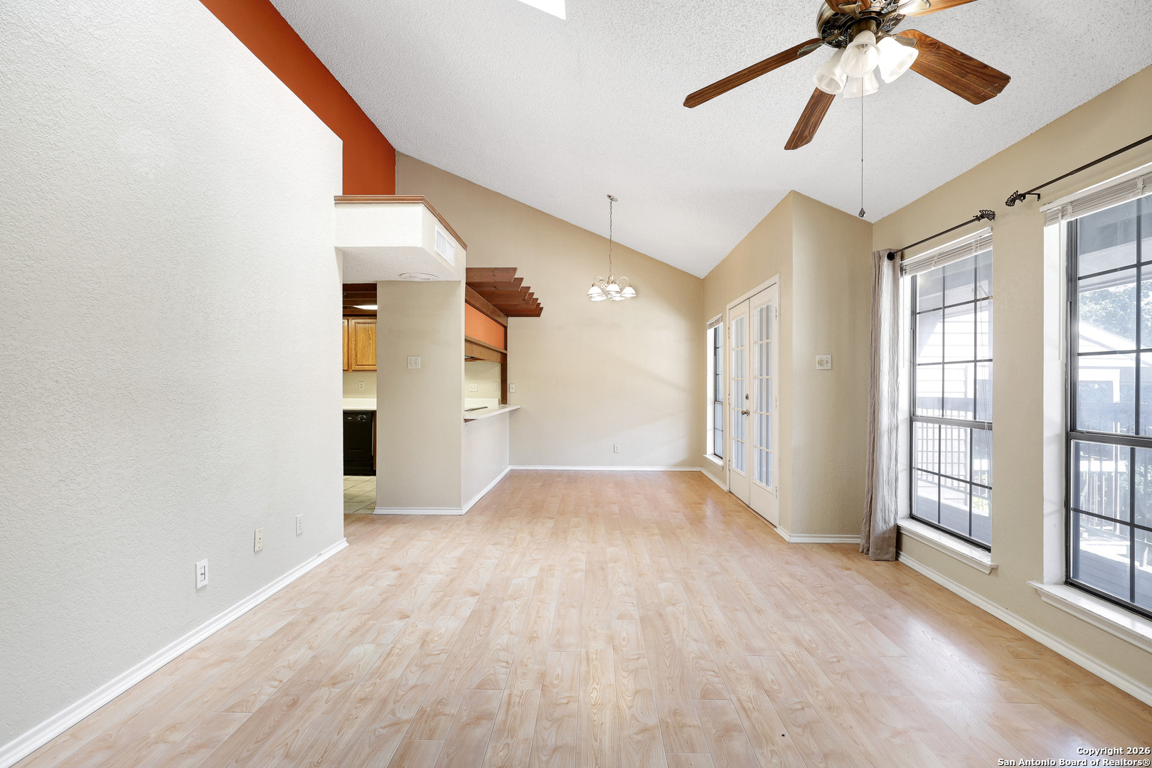 8633 Datapoint Drive, Unit 224 San Antonio, TX 78229 - Photo 6 of 27 a view of empty room with wooden floor and fan