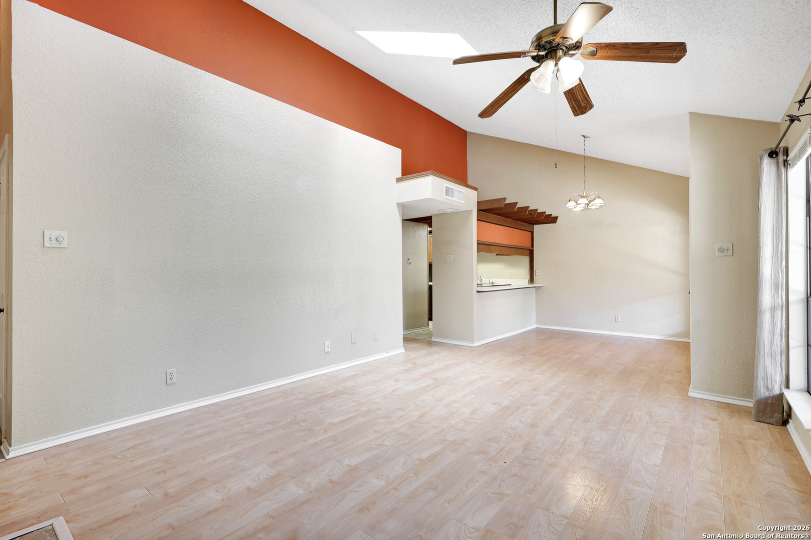 8633 Datapoint Drive, Unit 224 San Antonio, TX 78229 - Photo 7 of 27 a view of empty room with wooden floor and ceiling fan
