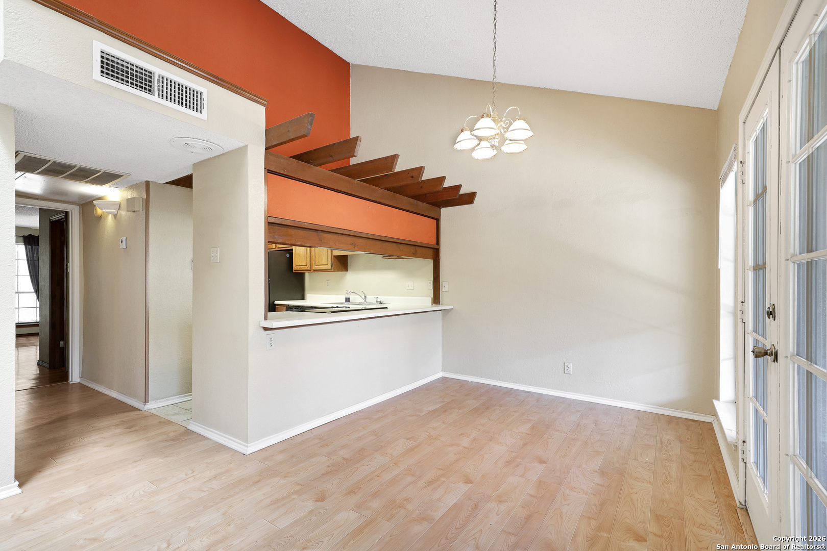 8633 Datapoint Drive, Unit 224 San Antonio, TX 78229 - Photo 9 of 27 a view of empty room with wooden floor