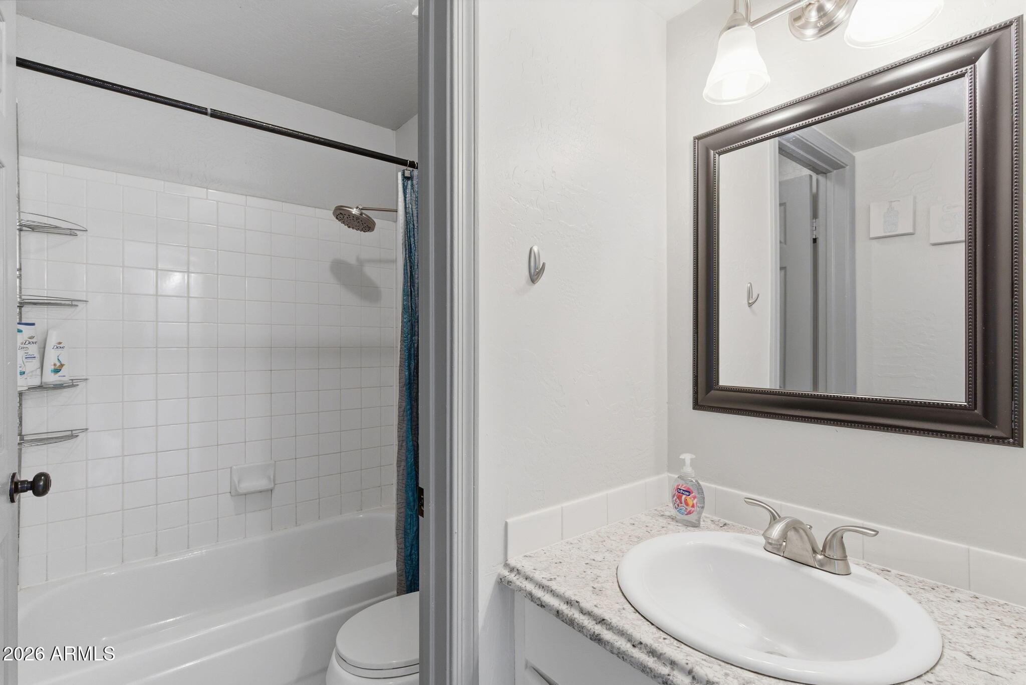 4218 West Boca Raton Road Phoenix, AZ 85053 - Photo 18 of 27 a bathroom with a granite countertop sink toilet and shower
