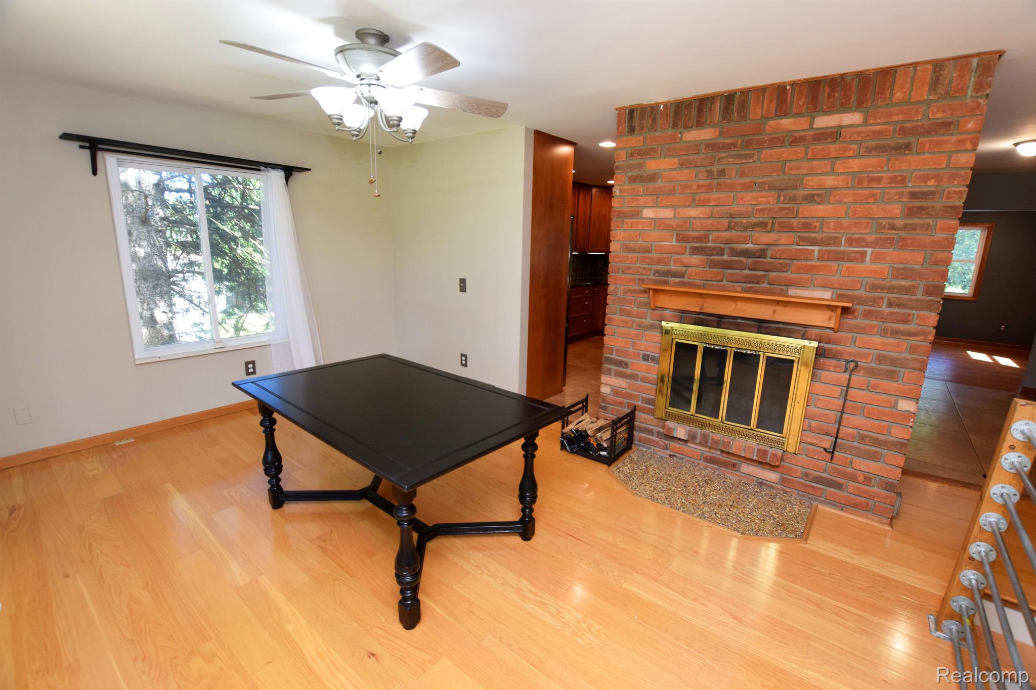 8087 East Carpenter Road Davison, MI 48423 - Photo 11 of 40 Dining, w/ double-sided, wood-burning fireplace