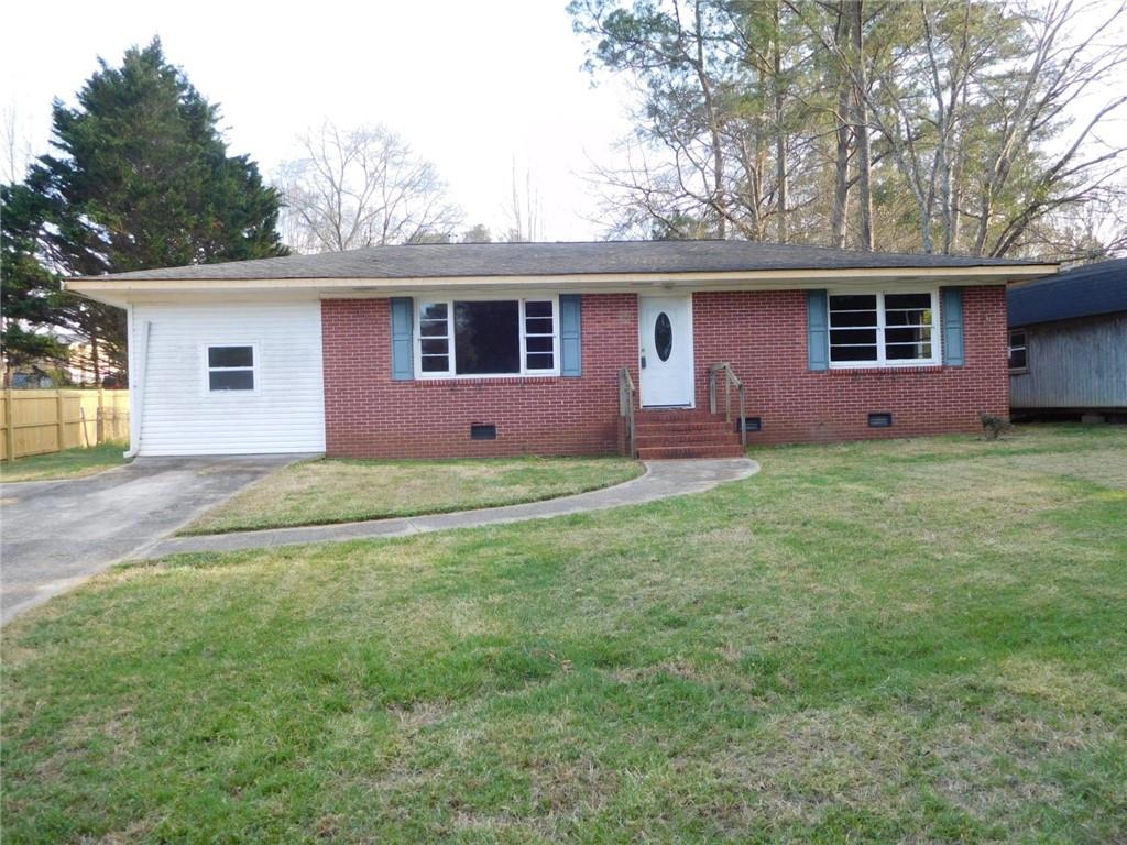 14 Lionel Lane Northeast Rome, GA 30161 - Photo 1 of 1 a front view of a house with a garden and yard
