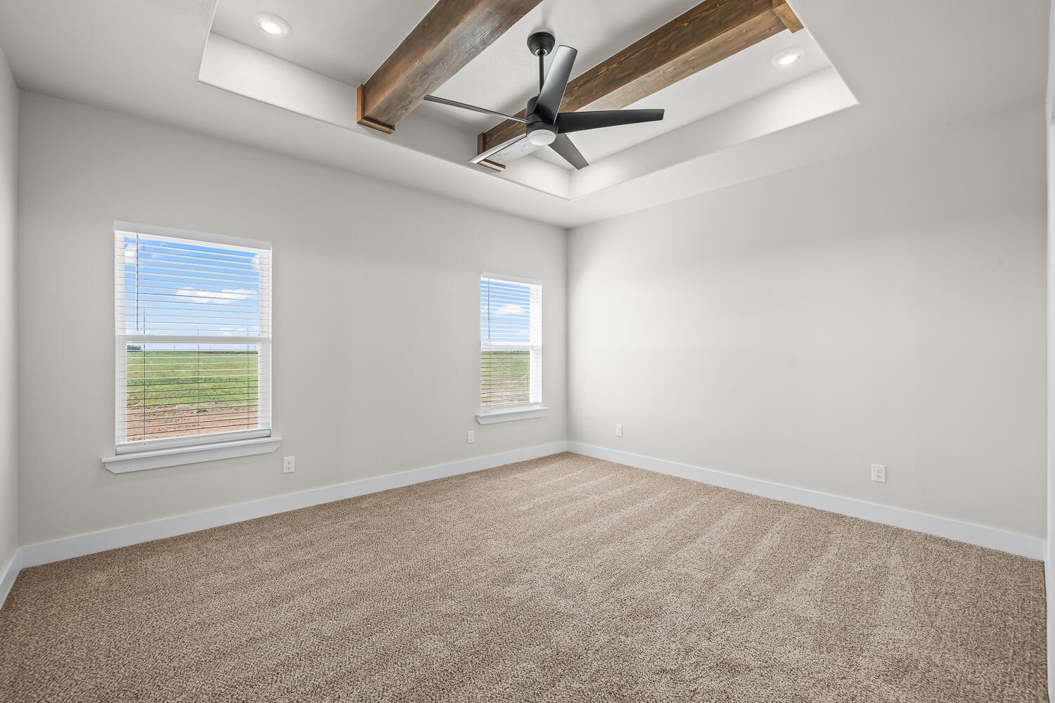 17414 C R 3100 Slaton, TX 79364 - Photo 16 of 46 an empty room with a ceiling fan and windows