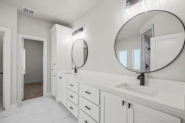 a bath tub sitting next to a white toilet