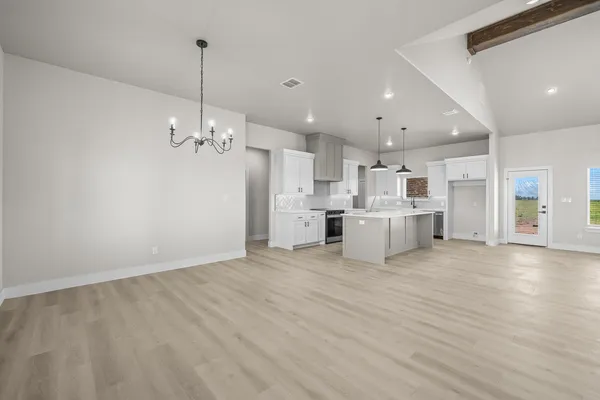 a kitchen with stainless steel appliances granite countertop a sink and cabinets