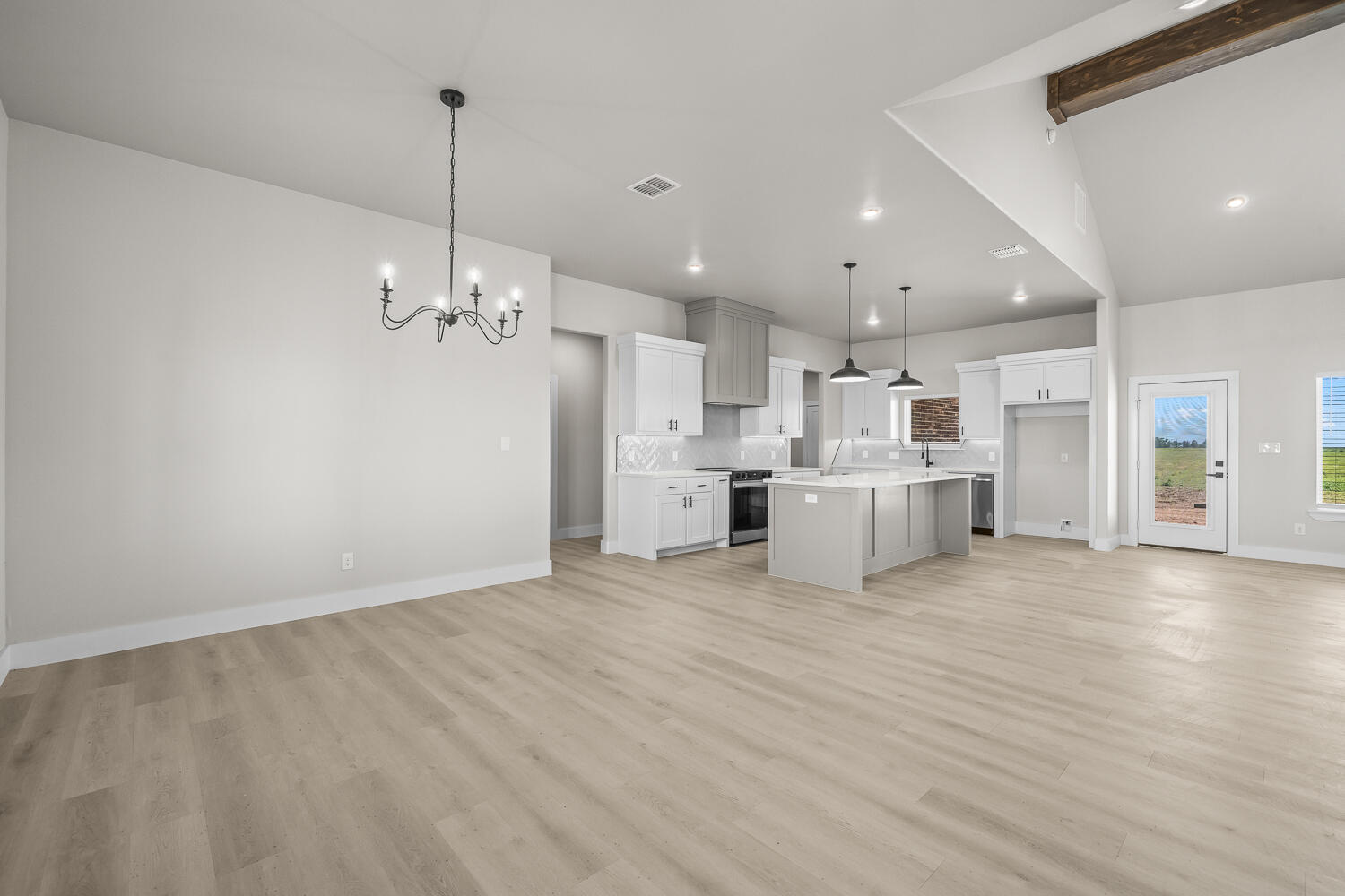 17414 C R 3100 Slaton, TX 79364 - Photo 33 of 46 a view of a kitchen with refrigerator and white cabinets