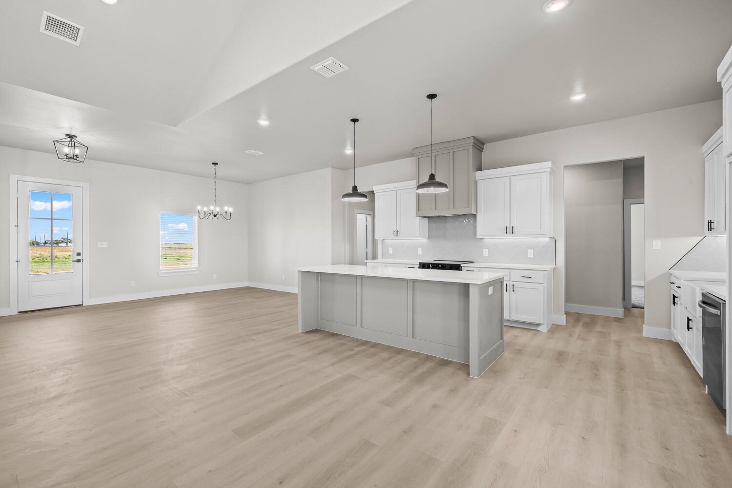 17414 C R 3100 Slaton, TX 79364 - Photo 38 of 46 a large kitchen with stainless steel appliances kitchen island a large counter top and a stove top oven