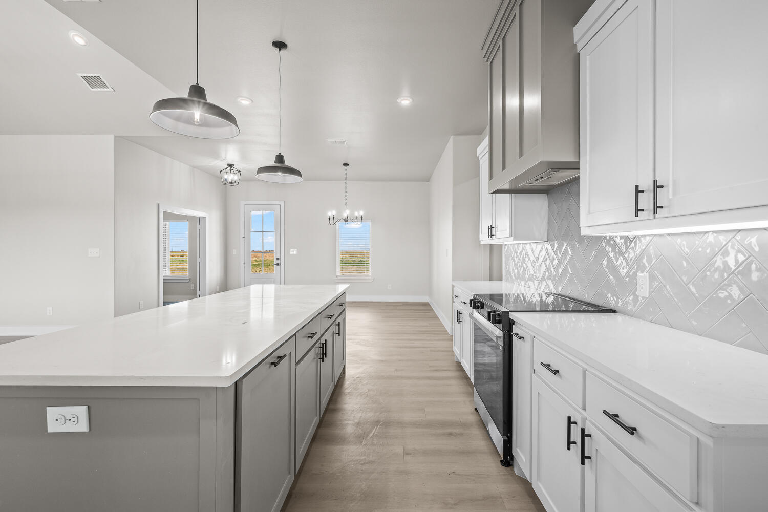 17414 C R 3100 Slaton, TX 79364 - Photo 39 of 46 a kitchen with stainless steel appliances a stove sink and cabinets