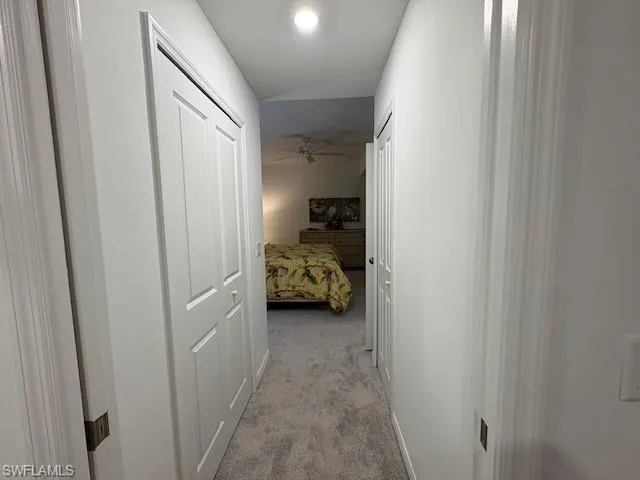 a bathroom with a shower sink and mirror