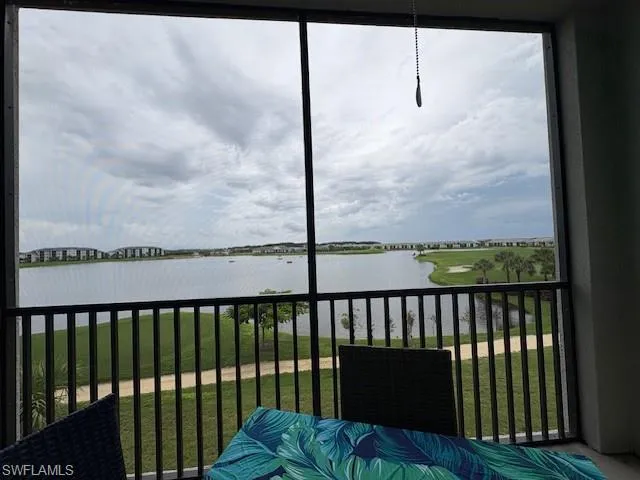 a bedroom with a bed and a tv on the dresser