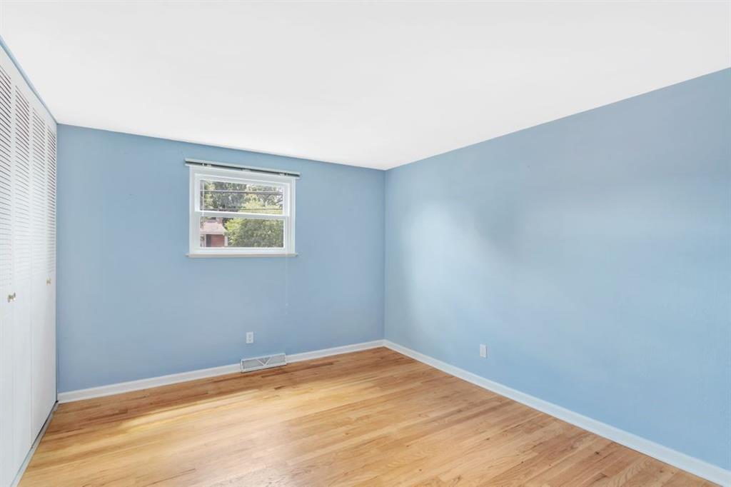 604 Dressel Road Allison Park, PA 15101 - Photo 16 of 25 The 3rd bedroom is situated in the front of the house. It features exposed hard wood floors, 1 window with blinds and a closet with organizers.