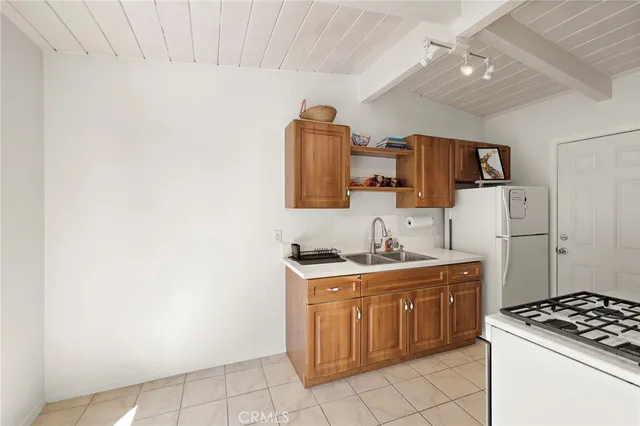 a kitchen with a stove and a refrigerator