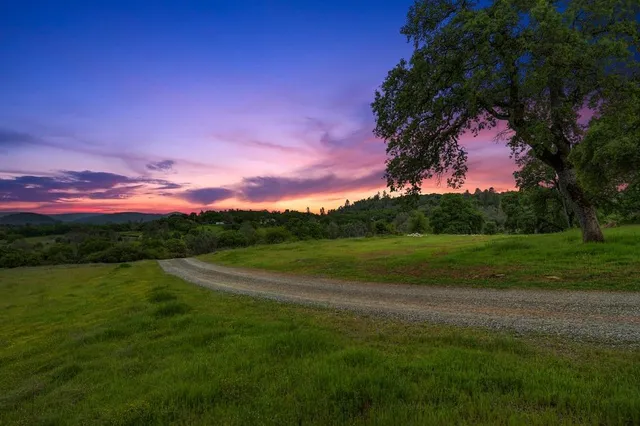 a view of a golf course with a lake