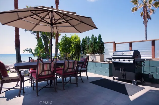 a view of a chairs and table in the patio
