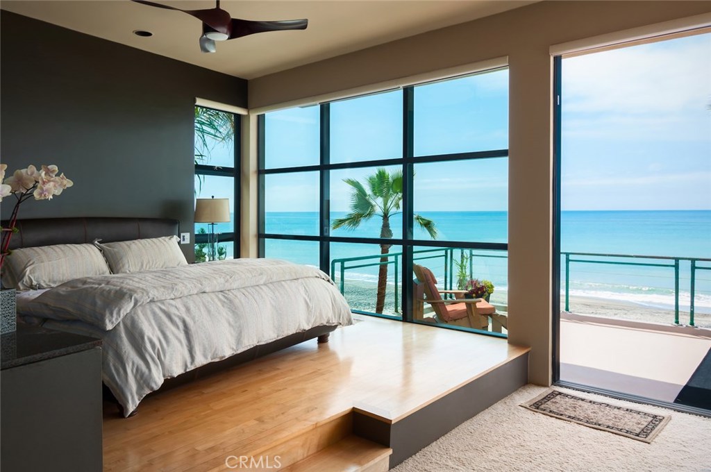 35121 Beach Road Dana Point, CA 92624 - Photo 16 of 46 a bedroom with a large bed and a large window
