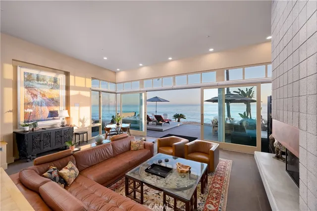 a living room with furniture and a floor to ceiling window