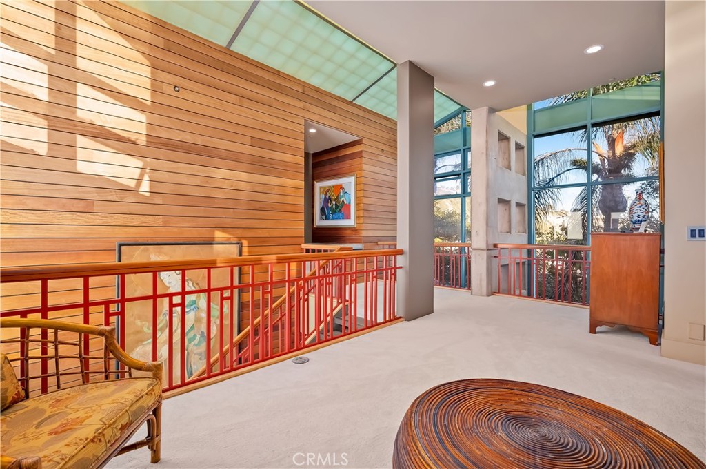 35121 Beach Road Dana Point, CA 92624 - Photo 26 of 46 a bedroom with a bed and wooden floor