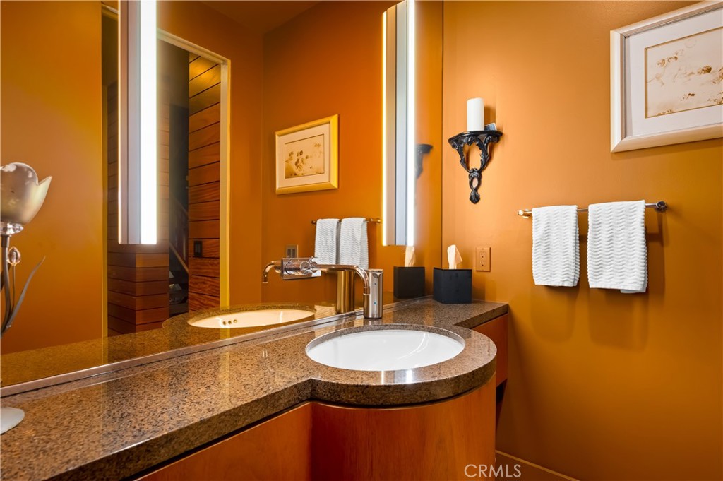 35121 Beach Road Dana Point, CA 92624 - Photo 35 of 46 a bathroom with a sink and a mirror