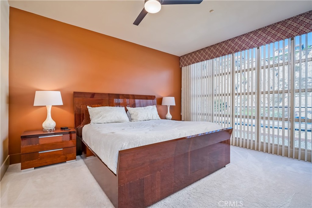 35121 Beach Road Dana Point, CA 92624 - Photo 37 of 46 a bed room with a bed and a lamp