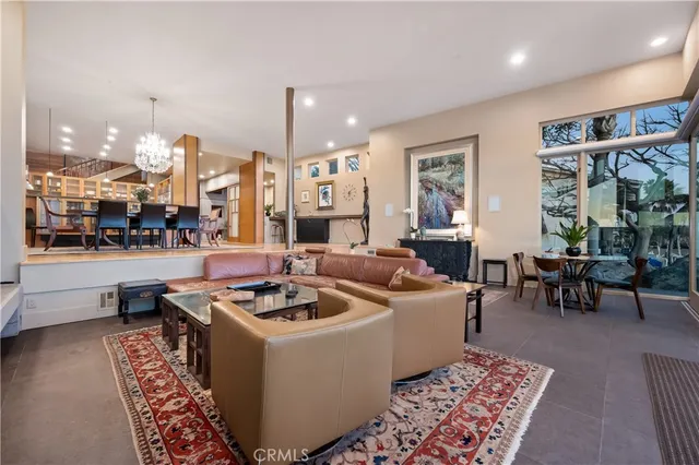 a living room with furniture and a rug