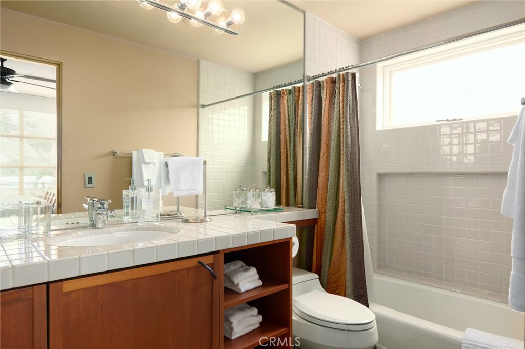 35121 Beach Road Dana Point, CA 92624 - Photo 46 of 46 a bathroom with a granite countertop sink toilet and shower