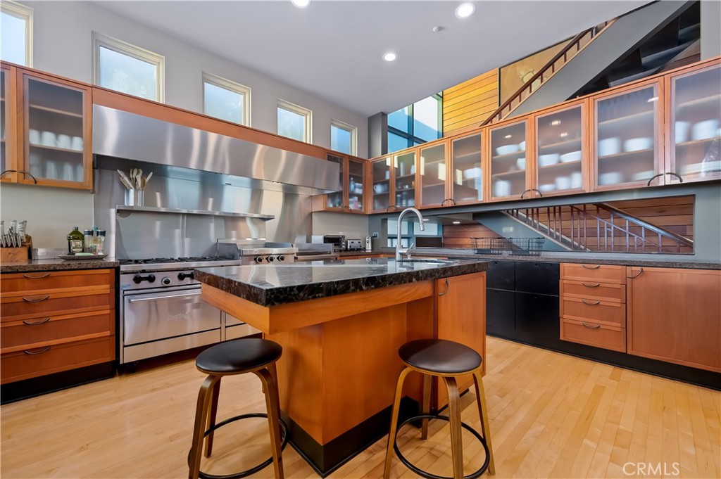 35121 Beach Road Dana Point, CA 92624 - Photo 5 of 46 a kitchen with granite countertop a stove and cabinets