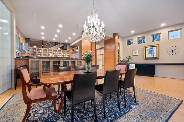 a view of a dining room with furniture and chandelier