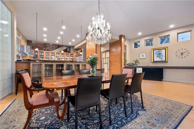 a view of a dining room with furniture and chandelier