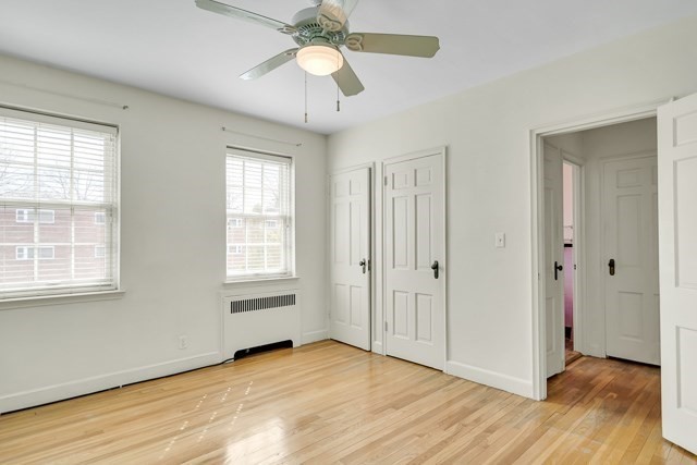 46 Browne Street, Unit 1 Brookline, MA 02446 - Photo 11 of 15 a view of an empty room with wooden floor and a window