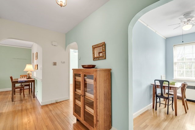 46 Browne Street, Unit 1 Brookline, MA 02446 - Photo 3 of 15 a dining room with furniture and wooden floor