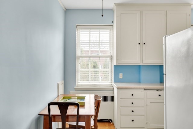 46 Browne Street, Unit 1 Brookline, MA 02446 - Photo 8 of 15 a room with a window and a dresser