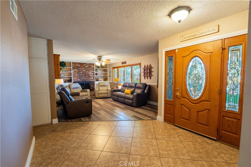 2501 East Avenue R4 Palmdale, CA 93550 - Photo 26 of 40 Living Room, look at that beautiful stained glass door once you enter.