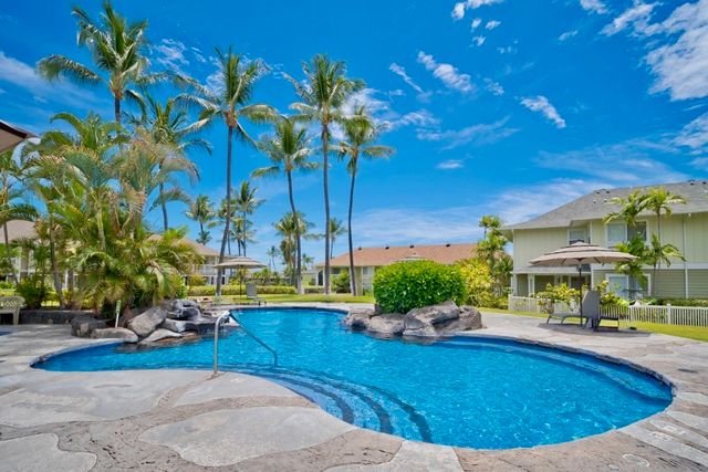a view of swimming pool with outdoor seating