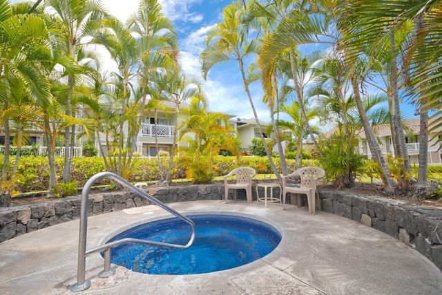 a view of swimming pool with outdoor seating