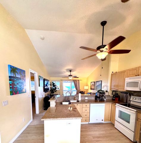 a kitchen with stainless steel appliances granite countertop a stove and refrigerator