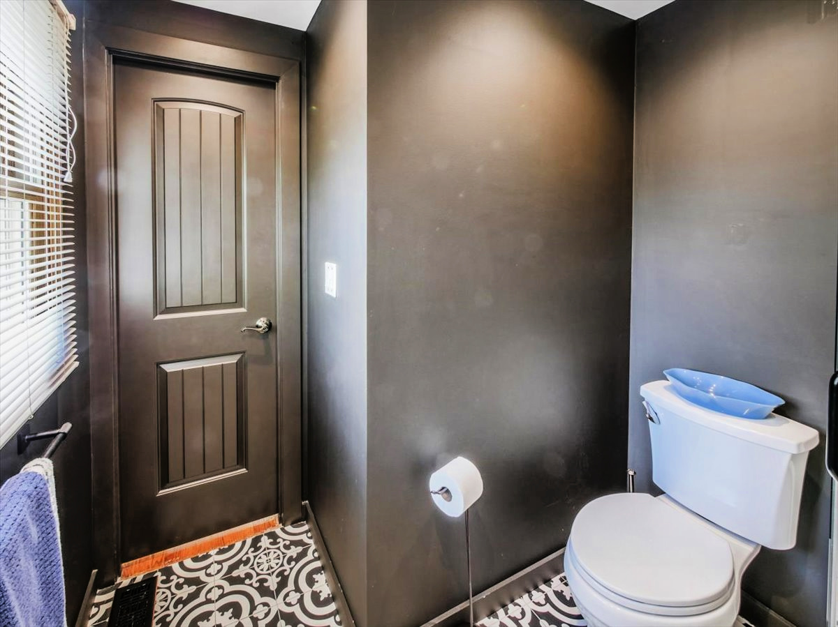 333 Rugby Place Schaumburg, IL 60169 - Photo 14 of 34 a white toilet sitting next to a bathroom sink